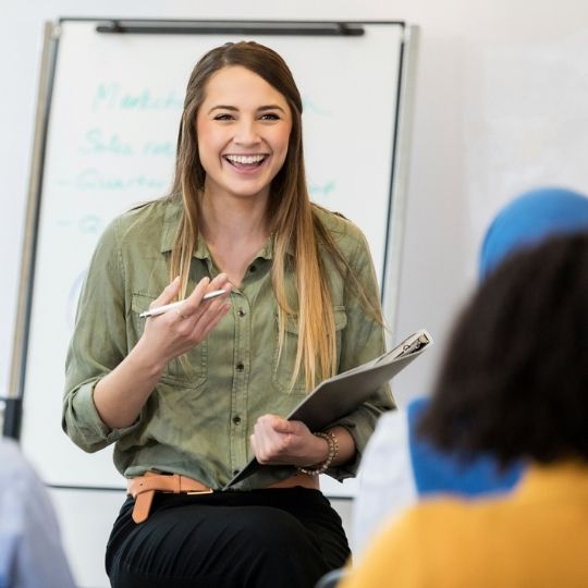 Female presenter in a group presentation